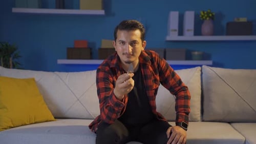 Psycho man holding the knife to the camera.