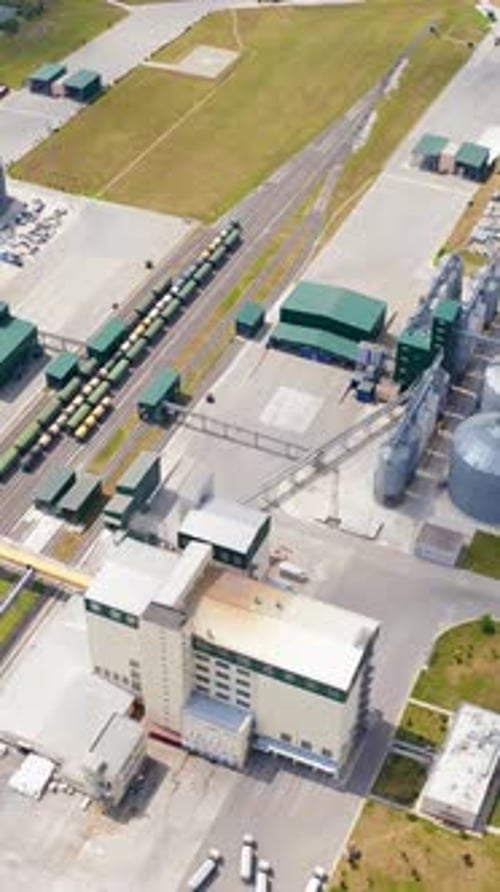 Big territory of farming storage warehouses. Agricultural huge metal factory storages.