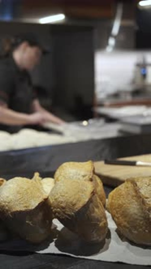 fresh bread in a restaurant kitchen, vertical video