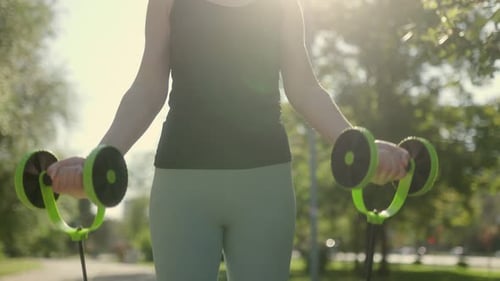 Close Up of a Confident Unrecognizable Doing Resistance Band Training Outside in the Park