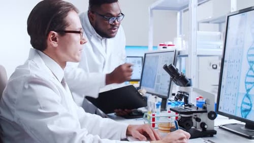 Scientists Collaborating on Research in a Modern Laboratory