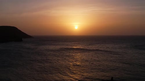 Sun setting down over the ocean at La Guajira beach, Colombia aerial footage