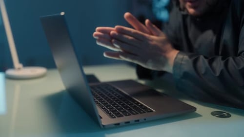 Closeup View of Hands Typing on a Laptop Focused on Cyber Fraud