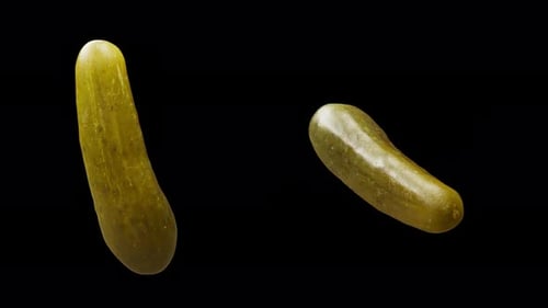Cyclic rotation of two types of cucumbers around their axis. Alpha channel.