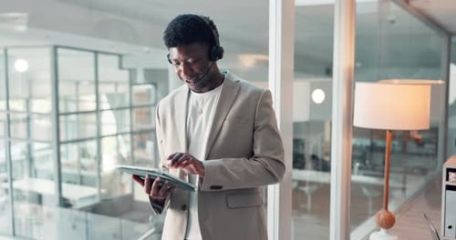 Black man, talk and headset with tablet at call centre for customer service, client advice and crm