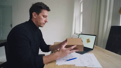 The Designer Works Develops the Design of the Box with the Help of a Computer