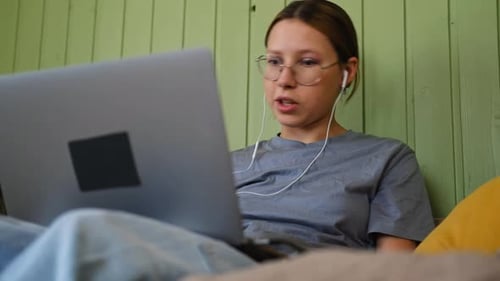 Teen Girl School Student Wear Headphones Watching Online Webinar Talking Through Webcam Looking at