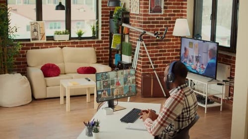 Man Attends Video Call at Home, Woman Enters