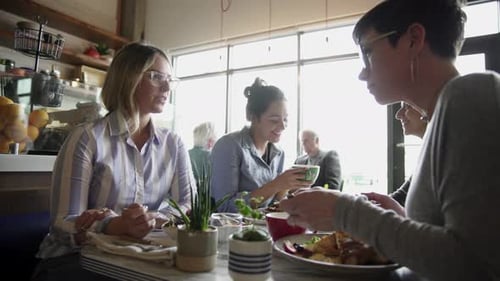 Women Enjoying Cafe Brunch Together
