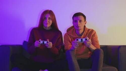 Young Adults Playing Video Games at Night