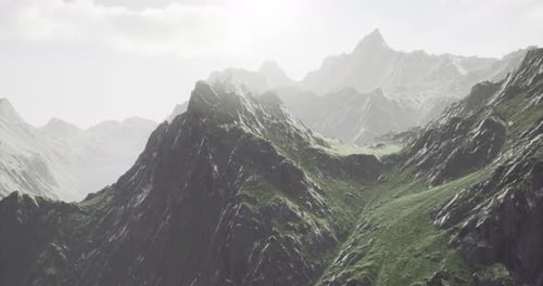 Majestic Mountain Peaks Bathed in Soft Light During a Serene Morning