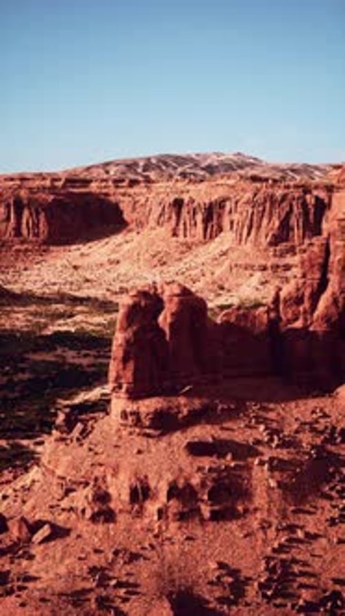 Rocky Landscape With Distant Mountain