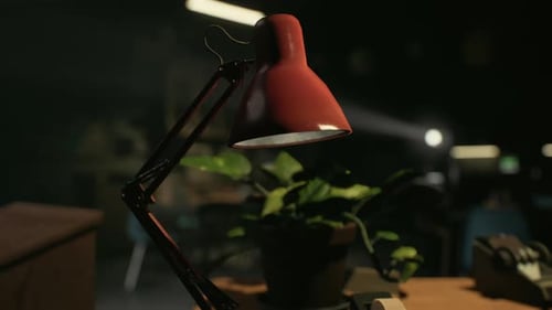 A Desk Lamp Sitting on Top of a Wooden Desk