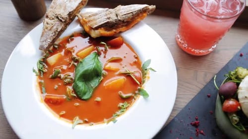 Tomato soup with fresh basil and toasted bread