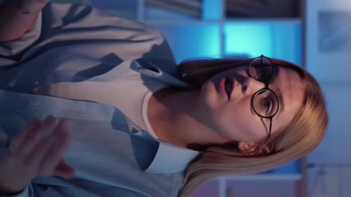 Young Adult Woman Talking and Gesturing Indoors