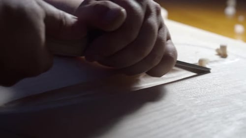 Close Up of Wood Carving Artisan Craftsmanship and Precision Hand Tool Use