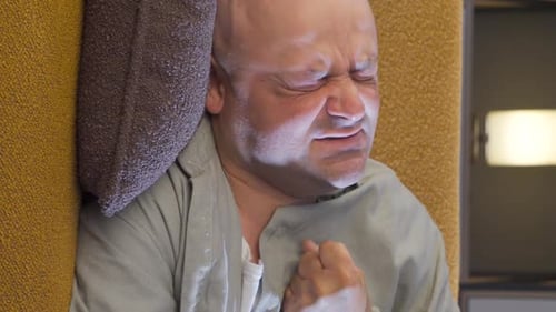 Man in Pain Lying Down