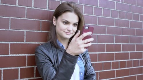 City Lifestyle Portrait of Attractive Female Person Chatting on Mobile Phone