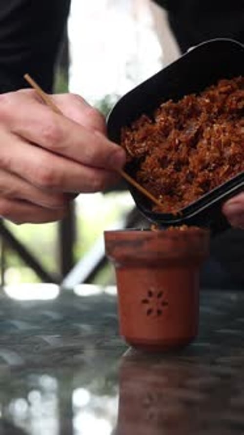 preparing a hookah at the bar