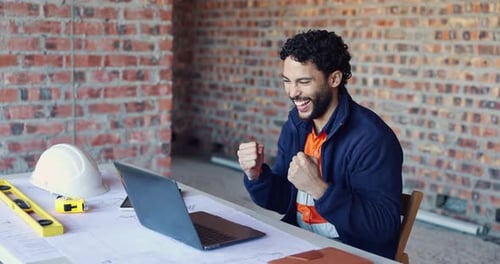 Building, man and fist pump at construction site with laptop, good news, email and project approval