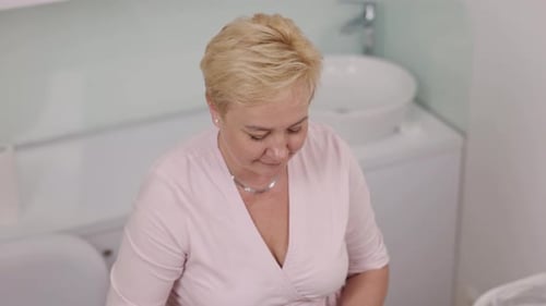 Woman Working at Medical or Cosmetic Facility