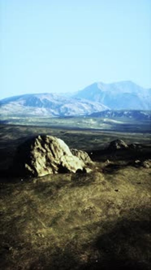 Large Rock on Grass Field