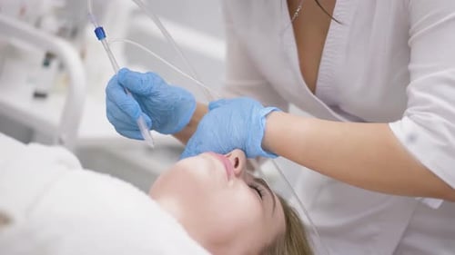 Cosmetologist Performs a Gasliquid Peeling Procedure Rejuvenation and Regeneration of the Skin Using