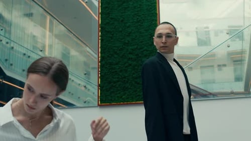 Business Couple Dancing in Modern Office Space