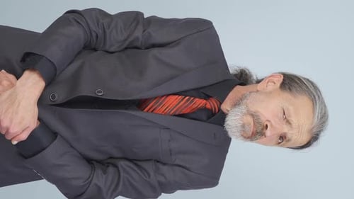 Senior Man in Formal Suit Standing Still