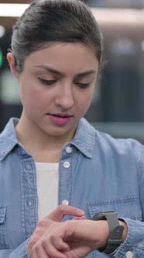 Woman Uses Smartwatch Device Indoors, Modern Technology