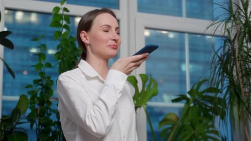 Voice Note Chatting or Talking of a Woman on the Phone at Work in the Office Businesswoman Talking