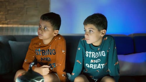 Boys Sitting Together, Watching Television at Home