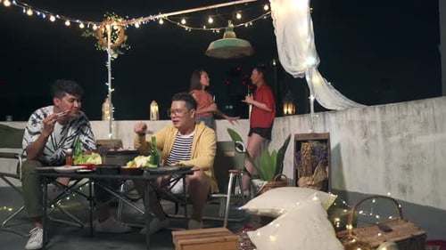4K Group of Asian people having dinner party together at outdoor rooftop.