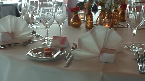Shinning glasses and tableware on wedding day, close up motion shot