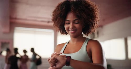 Woman, gym and check pulse on smart watch, cardio statistics and results of workout on app