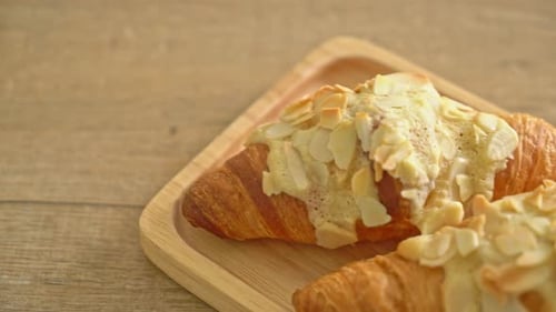 Almond Croissants on Wooden Tray Close Up