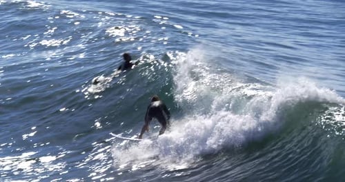 Surfer rides a powerful wave in Hawaii close up slow motion action sports