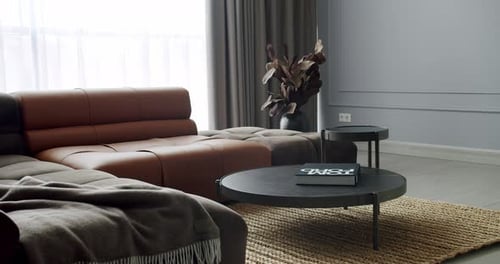 Luxury Modern House Interior With Corner Sofa and Round Table