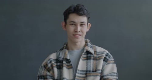 Young Adult Giving Thumbs Up Gesture