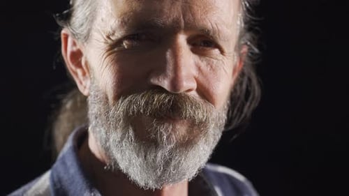 Close-up mature man laughing. Attractive smile.