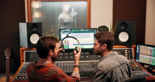 Studio, male producer with headphones for listening, hearing or track consistency of song