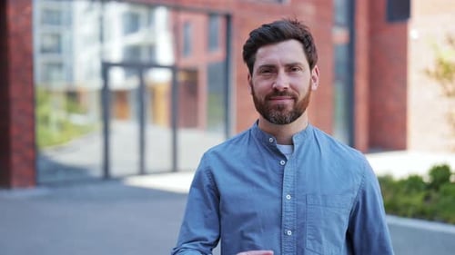 Happy Businessman Showing Thumbs Up Near Office Building