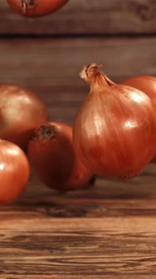 Onion Falls on the Table Filmed is Slow Motion 1000 Fps