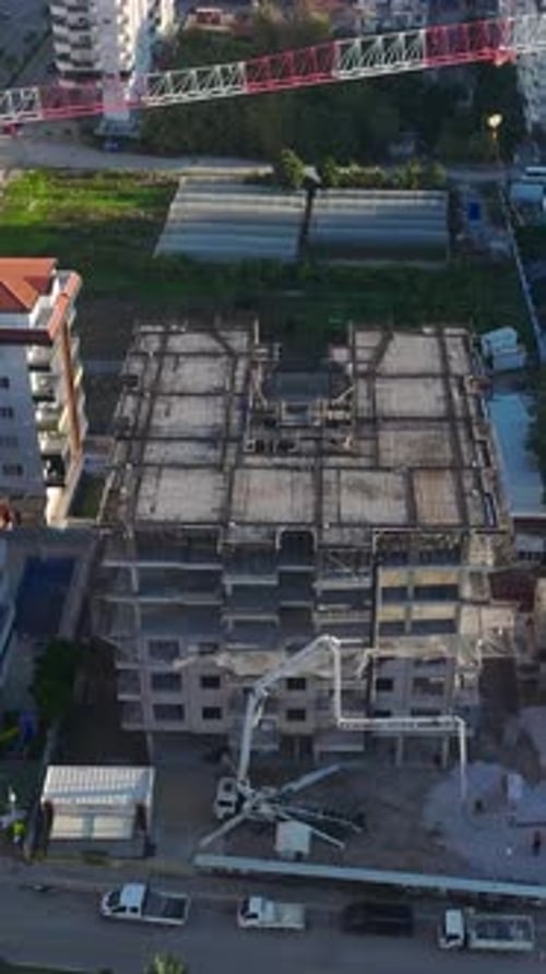 Vertical Video Construction Workers Installing Supports and Preparing Scaffolding Captured