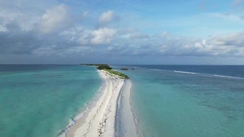 Aerial above fine white sand Beach Paradise of Dhigurah Island sandbank, Maldives.