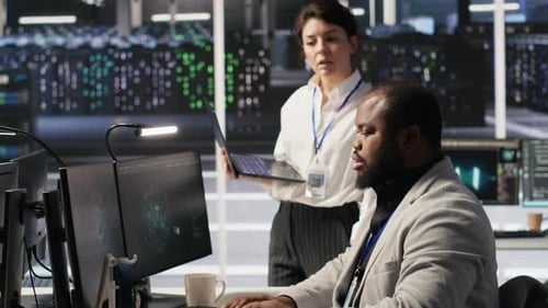 Happy Data Center Manager Providing Positive Feedback to Engineer