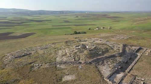 Aerial View Of The Ancient City On The Hill And Green Fields