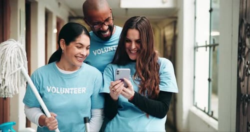 Smiling Volunteers Collaborate, Working Together Indoors