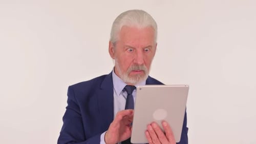 Senior Man Reacts to Tablet on White Background