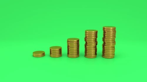 Growing stacks of gold coins on green screen